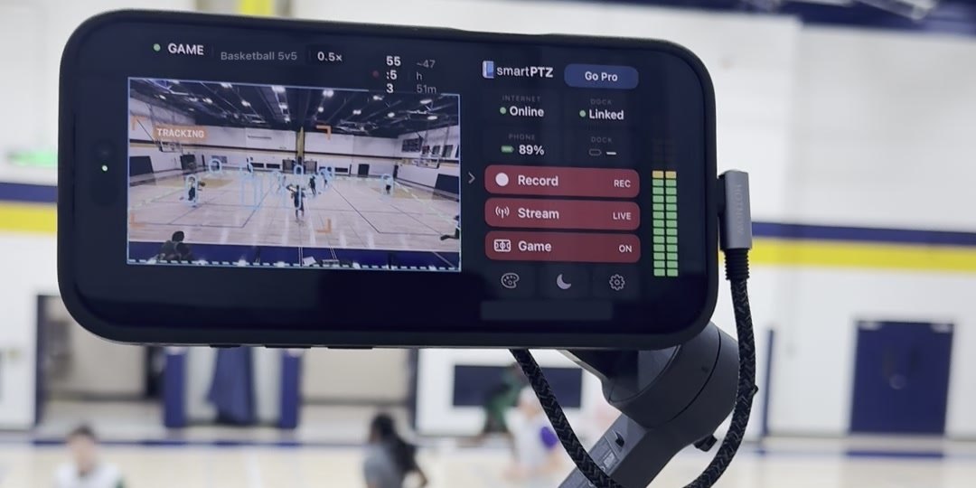 An iPhone on a gimbal at a basketball game, smartPTZ Game Tracking following the play